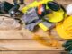 Work,Safety.,Construction,Site,Protective,Equipment,On,Wooden,Background,,Flat